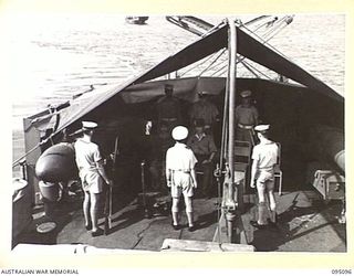 AT SEA, OFF BUIN, BOUGAINVILLE, 1945-08-20. A JAPANESE MESSENGER ACCOMPANIED BY A CIVILIAN INTERPRETER WITH THE JAPANESE ARMY, AFTER DELIVERING MESSAGE FROM LIEUTENANT-GENERAL M. KANDA, COMMANDER ..