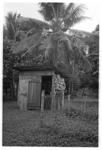 Man outside small shed