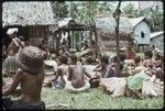 Mortuary ceremony: women participate in ritual exchange of banana leaf bundles and foods