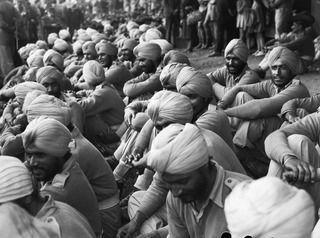 BRISBANE, QUEENSLAND, AUSTRALIA. 1944-08-08. SIKH SOLDIERS RESTING ON THE GRASS IN CENTENARY PARK AT THE CONCLUSION OF THE 7TH DIVISION MARCH THROUGH THE CITY. THESE TROOPS WERE RECENTLY RELEASED ..