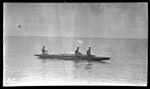Three men on canoe