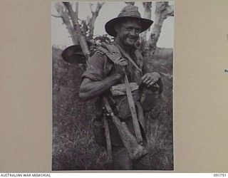WEWAK AREA, NEW GUINEA, 1945-05-10. PTE R.E.N. ROWLANDS, 2/4 INFANTRY BATTALION, A MEMBER OF THE FIRST COMPANY TO ENTER THE JAPANESE BASE AFTER THE JAPANESE STRONGHOLD HAD FALLEN