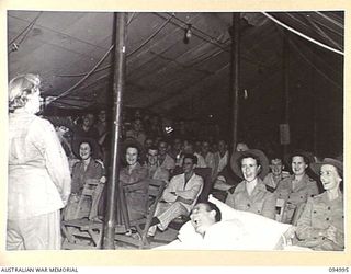 WUNUNG, JACQUINOT BAY. 1945-08-17. AN ENTHUSIASTIC AUDIENCE OF PATIENTS, NURSING STAFF AND MALE ORDERLIES OF 105 CASUALTY CLEARING STATION LISTENING TO GRACIE FIELDS AS SHE SINGS A FAMOUS NUMBER