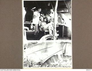 FLIGHT LIEUTENANT R.F. DEACON OF THE RAAF DENTAL SERVICE, TREATING A PATIENT AT TOROKINA, BOUGAINVILLE, IN 1945-02. PHOTOGRAPH PUBLISHED IN AUSTRALIA IN THE WAR OF 1939-45, MEDICAL, VOL 4, MEDICAL ..