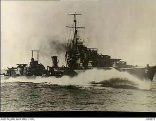New Guinea. C. 1945. Starboard side view of HMAS Warramunga at sea proceeding at full steam ahead