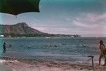 A view of people enjoying the water sports in Waikiki Beach, in Honolulu Hawaii. This photo was taken by a member of the scientific party while taking a break during the Midpac Expedition (1950). 1950