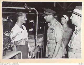 JACQUINOT BAY, NEW BRITAIN, 1945-07-02. HIS ROYAL HIGHNESS, THE DUKE OF GLOUCESTER, GOVERNOR-GENERAL OF AUSTRALIA (2), VISITED 2/8 GENERAL HOSPITAL. HE IS PICTURED ABOVE TALKING TO SAPPER PINCOTT, ..