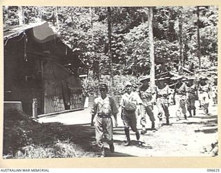 BONIS PENINSULA, BOUGAINVILLE. 1945-09-15. AFTER SURRENDER DISCUSSIONS AT JAPANESE NAVAL HEADQUARTERS, BONIS PENINSULA, THE AUSTRALIAN SURRENDER PARTY, MEMBERS OF HEADQUARTERS 2 CORPS, INSPECTED ..