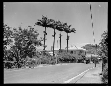 Ile Nou, New Caledonia, showing a road with a two-storied wooden building