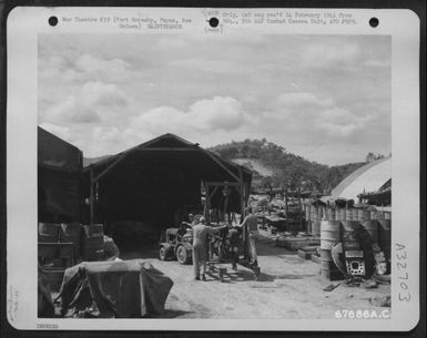 An Airplane Engine Is Hauled To The Repair Shop Of The 27Th Air Depot Group At The Port Moresby Air Depot, Papua, New Guinea. (U.S. Air Force Number 67686AC)