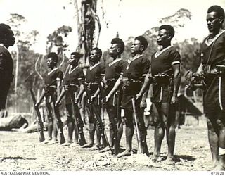 KAMALGAMAN ANCHORAGE, JACQUINOT BAY, NEW BRITAIN. 1944-12-23. PERSONNEL OF THE ROYAL PAPUAN CONSTABULARY ON PARADE AT HEADQUARTERS, AUSTRALIAN NEW GUINEA ADMINISTRATIVE UNIT, NEW BRITAIN DISTRICT. ..