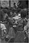 Mortuary ceremony: women carry banana leaf bundles (wealth items) to place in exchange