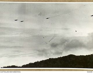 FARIA RIVER, NEW GUINEA. 1944-01-20. MITCHELL MOVING INTO ATTACK JAPANESE POSITIONS ACROSS MAIN CREEK