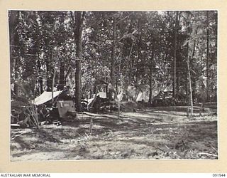 SORAKEN AREA, BOUGAINVILLE ISLAND, 1945-04-02. IN THE FOREGROUND IS THE TANK ATTACK COMPANY, 26 INFANTRY BATTALION AREA. IN THE BACKGROUND, AT D COMPANY, 26 INFANTRY BATTALION, POSITION A CLASS IS ..