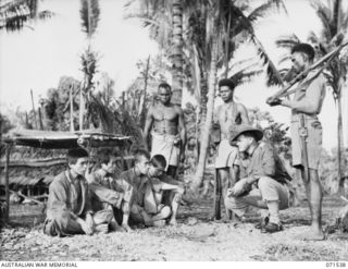 SINGORKAI, NEW GUINEA. 1944-03-19. FOUR JAPANESE PRISONERS BEING INTERROGATED BY QX55306 LIEUTENANT C. E. BISHOP (1), OFFICER COMMANDING A PATROL OF THE PAPUAN INFANTRY BATTALION