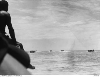 LAE, NEW GUINEA. 1943-10-17. BARGE CONVOY (TILLEY FORCE) OF THE 29/46TH AUSTRALIAN INFANTRY BATTALION. ONE PLATOON PROCEEDED TO BUKAUA AND THE REMAINDER PROCEEDED TO MONGI RIVER TO CLEAR THE ..