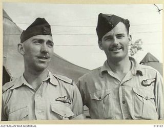 1943-06-26. NEW GUINEA. AUSTRALIAN BEAUFIGHTER CREWS. P/O. E.M. MARRON OF ST. KILDA, VICTORIA (PILOT) AND SGT. C.V. GOLLAN, OF CORRAKI, N.S.W. (OBSERVER). (NEGATIVE BY N. BROWN)