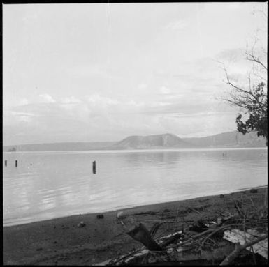 Remains of a jetty with the  Beehives and mountains in the distance, Rabaul Harbour, New Guinea, 1937 / Sarah Chinnery