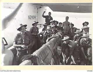 JACQUINOT BAY, NEW BRITAIN, 1945-08-22. TROOPS OF C COMPANY, 37/52ND INFANTRY BATTALION, AFTER THEIR RETURN FROM NANTAMBU IN LESS THAN AN HOUR BY ROYAL NEW ZEALAND AIR FORCE CATALINA AIRCRAFT. THEY ..