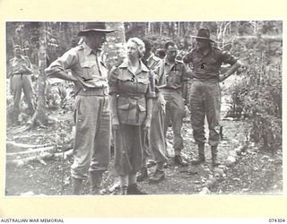 MADANG, NEW GUINEA. 1944-07-27. MEMBERS OF THE EMPIRE PARLIAMENTARY DELEGATION CHATTING WITH MEMBERS OF THE STAFF OF THE 2/7TH AUSTRALIAN GENERAL HOSPITAL DURING THEIR TOUR OF THE AREA. IDENTIFIED ..