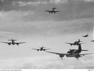 VIVIGANI, GOODENOUGH ISLAND, PAPUA. 1944-01-17. BEAUFORT BOMBER AIRCRAFT OF NO. 100 (BEAUFORT) SQUADRON RAAF IN FORMATION SHORTLY AFTER TAKE-OFF AS PART OF A MASSED DAYLIGHT RAID ON AN ENEMY CAMP ..