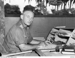 LAE, NEW GUINEA. 1944-11-09. NX114729 LIEUTENANT J.N.G. MCDONAGH, OFFICER- IN- CHARGE B COMPANY, 112TH CONVALESCENT DEPOT AT WORK IN HIS OFFICE