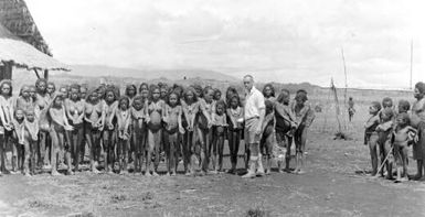 Divine Word Mission, Mount Hagen, 1934, showing A.J. Bearup cleaning people's arms for TB skin tests [G. Heydon]