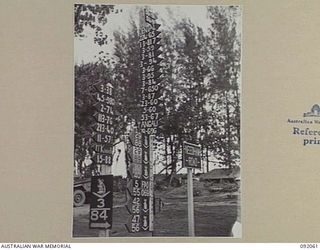 BOUGAINVILLE. 1945-05-16. ROAD AND UNIT SIGNS OF HEADQUARTERS 3 DIVISION ERECTED ON THE TOKO-DARARA ROAD SOUTH BOUGAINVILLE