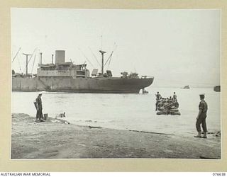 LAE, NEW GUINEA. 1944-11-02. TROOPS OF THE 14/32ND INFANTRY BATTALION ABOARD AN AMPHIBIOUS LOAD CARRIER MAKING THEIR WAY THROUGH THE SURF TO THE TROOPSHIP, "CAPE ALEXANDER"