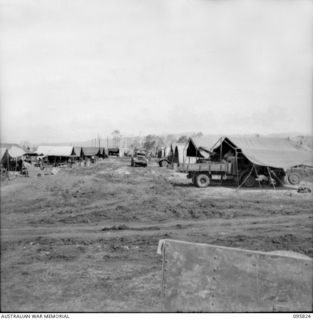 CAPE WOM, WEWAK AREA, NEW GUINEA. 1945-08-29. GENERAL VIEW OF THE CAMP AREA, 110 BRIGADE WORKSHOP, CORPS OF AUSTRALIAN ELECTRICAL AND MECHANICAL ENGINEERS