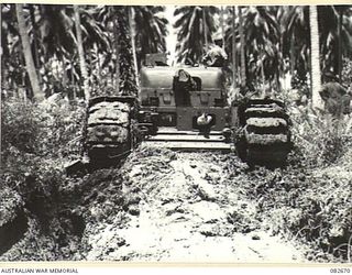 MADANG, NEW GUINEA. 1944-10-12. A CHURCHILL V TANK MOVING FROM A BOG AT HQ 4 ARMOURED BRIGADE