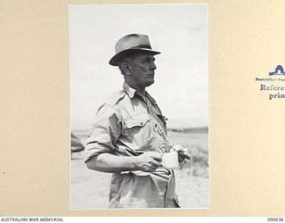 NADZAB, NEW GUINEA. 1945-04-14. SENATOR FRASER, ACTING MINISTER FOR THE ARMY, HAVING A CUP OF TEA AT THE AERODROME PRIOR TO HIS DEPARTURE FROM HEADQUARTERS FIRST ARMY FOR AUSTRALIA