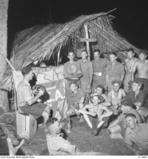 1942-12-17. PAPUA. Y.M.C.A. OFFICER, FERN HOOPER, ONE OF THE BEST KNOWN IDENTITIES BETWEEN PORT MORESBY AND THE NORTH COAST OF NEW GUINEA. EACH DAY HE SERVES UPWARDS OF 1400 CUPS OF TEA. HIS DAY'S ..