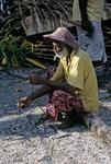 Old man rebraids cord for lashing