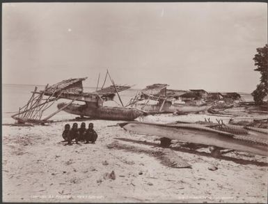 Children with canoes on a beach at Pileni, Reef Islands, 1906 / J.W. Beattie