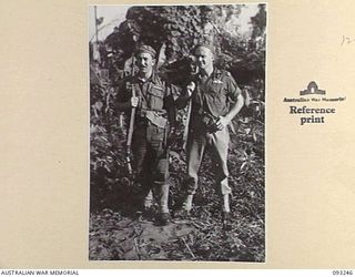 CHABAI/SORAKEN AREA, BOUGAINVILLE, 1945-06-19. FLYING OFFICER (FO) K.G. BEECH (1) AND FO J.L. WHITFORD (2), TWO BOOMERANG PILOTS FROM 5 TACTICAL RECONNAISSANCE SQUADRON, RAAF, WHO PAID A VISIT TO ..