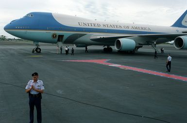 Air Force One, a VC-25A aircraft, stands on the runway as President William Jefferson Clinton and Hillary Rodham Clinton prepare to debark from the plane. The Clintons, along with Secretary of Defense Les Aspin, will be touring area military installations during their three-day stay