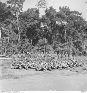 Outdoor group portrait of fifty three personnel of the 2/8th Commando Squadron. Identified, back row, left to right: Trooper (Tpr) B T Marr (38); Tpr J Phillips (39); Tpr J F Guerin (40); Tpr C ..