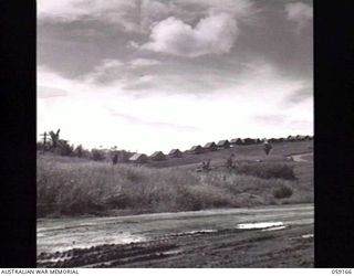 BISIATABA, NEW GUINEA. 1943-11-04. THE ROAD LEADING TO THE ROYAL PAPUAN CONSTABULARY DEPOT. NOTE THE LINEUP OF TENTED ACCOMMODATION