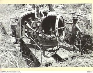 1943-09-25. NEW GUINEA. FALL OF LAE. JAPANESE SEARCHLIGHT LEFT BEHIND WHEN THE JAPANESE ABANDONED LAE