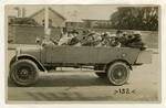 Group of men and women in a charabanc, Tasmania, c1925