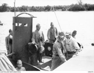 SORAKEN PENINSULA, BOUGAINVILLE. 1945-09-14. A MOTOR LAUNCH CARRYING MEMBERS OF HEADQUARTERS 2 CORPS, PREPARED FOR SURRENDER DISCUSSIONS WITH THE JAPANESE AT A SEA RENDEZVOUS OFF SORAKEN PENINSULA, ..