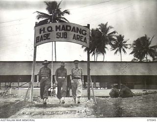 MADANG, NEW GUINEA. 1944-08-29. THREE SENIOR NON COMMISSIONED OFFICERS COMING DOWN THE STEPS OF THE NEW ADMINISTRATION BLOCK OF THE MADANG BASE SUB AREA. THEY ARE:- NX37063 SERGEANT R. BERMAN (1); ..