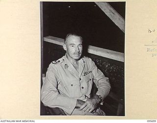JACQUINOT BAY, NEW BRITAIN. 1945-09-01. MAJOR GENERAL K.W. EATHER, GENERAL OFFICER COMMANDING 11 DIVISION AT HEADQUARTERS 11 DIVISION