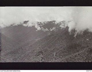 BULLDOG ROAD, NEW GUINEA, 1943-07-17. LOOKING DOWN THE CLOUD TOPPED ELOA VALLEY FROM BANNON'S LOOKOUT