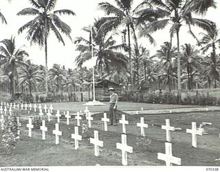 MILNE BAY, NEW GUINEA, 1944-02-09. A GENERAL VIEW OF THE MILNE BAY WAR CEMETERY. THE GRAVE OF 408253 FLIGHT SERGEANT DONALD KEVAN COOPER LIES FIFTH FROM THE LEFT IN THE BACK ROW IN FRONT OF THE ..
