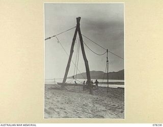 DANMAP RIVER, NEW GUINEA. 1945-01-05. THE FLYING FOX WHICH WAS CONSTRUCTED BY AND IS OPERATED BY PERSONNEL OF THE 2/14TH AUSTRALILAN FIELD COMPANY, ROYAL AUSTRALIAN ENGINEERS, ACROSS THE DEEP MOUTH ..