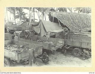 POTSDAM-HANSA BAY AREA, NEW GUINEA. 1944-07-31. PERSONNEL OF THE MOTOR TRANSPORT PLATOON, 30TH INFANTRY BATTALION RECONDITIONING CAPTURED JAPANESE TRUCKS IN THE UNIT WORKSHOP. IDENTIFIED PERSONNEL ..