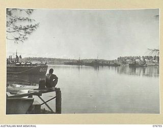 MADANG, NEW GUINEA. 1944-10-26. UNITS OF THE RAN AT ANCHOR IN THE HARBOUR. THEY ARE LEFT TO RIGHT: HMAS BARCOO, FRIGATE; HMAS LATROBE CORVETTE; HMAS VENDETTA, DESTROYER