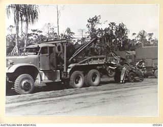 CAPE WOM, WEWAK AREA, NEW GUINEA, 1945-08-24. CRAFTSMAN R.A. MCKENZIE (1), CRAFTSMAN H. SCOTT (2) AND CRAFTSMAN H.A. WATSON (3), MEMBERS OF 2/119 BRIGADE WORKSHOP, CORPS OF AUSTRALIAN ELECTRICAL ..